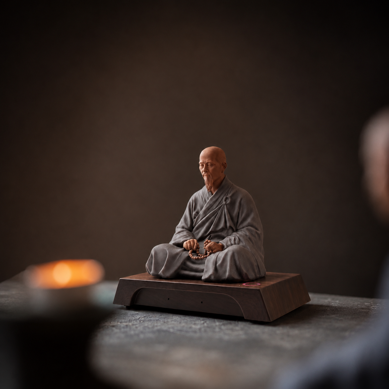 Master Xuyun AI figurine in grey robes, seated on a dark wooden base